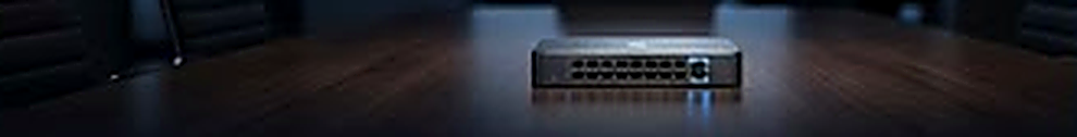 A network switch on a polished boardroom table